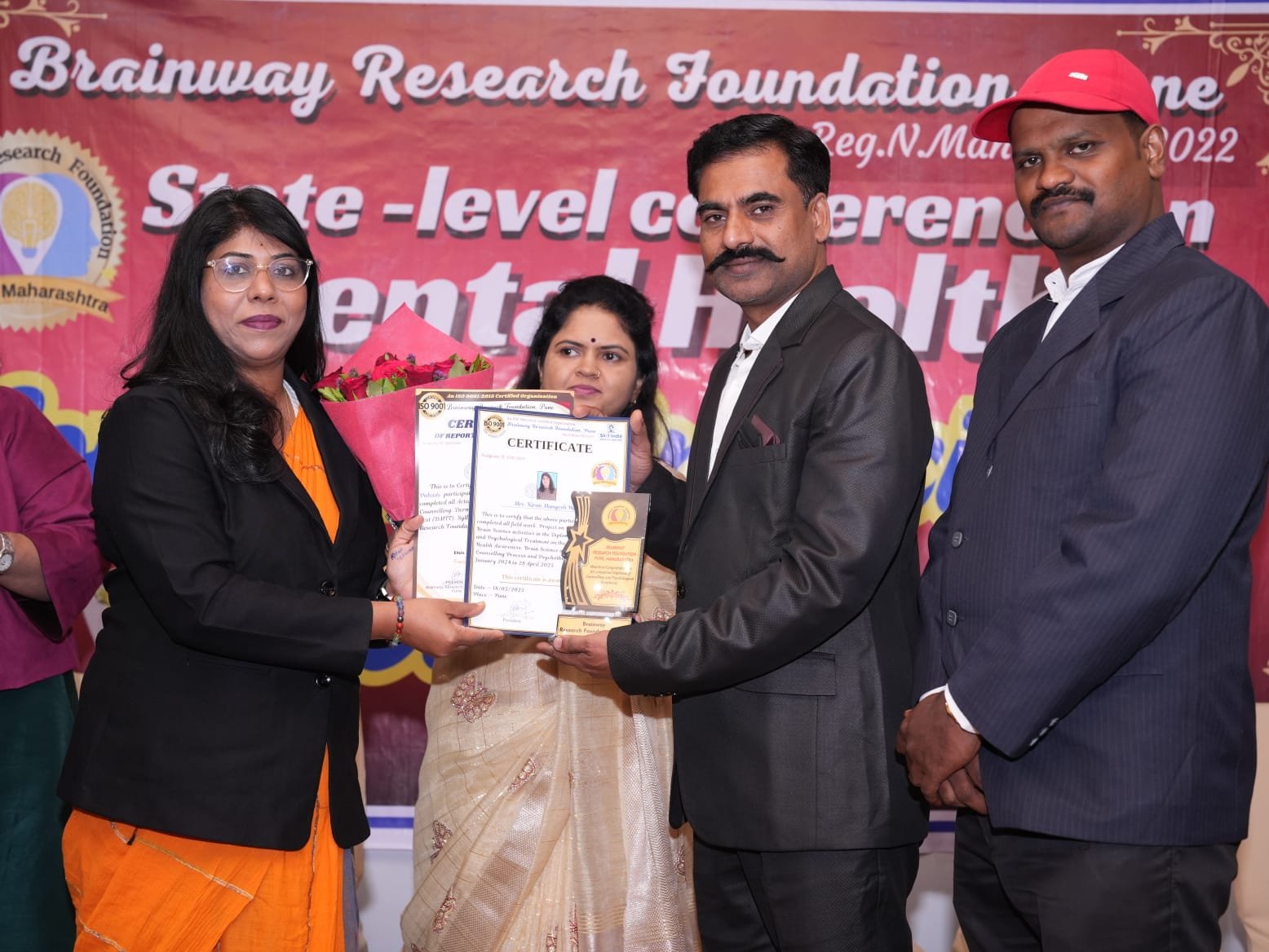 Kiran Pahade receiving recognition at an event